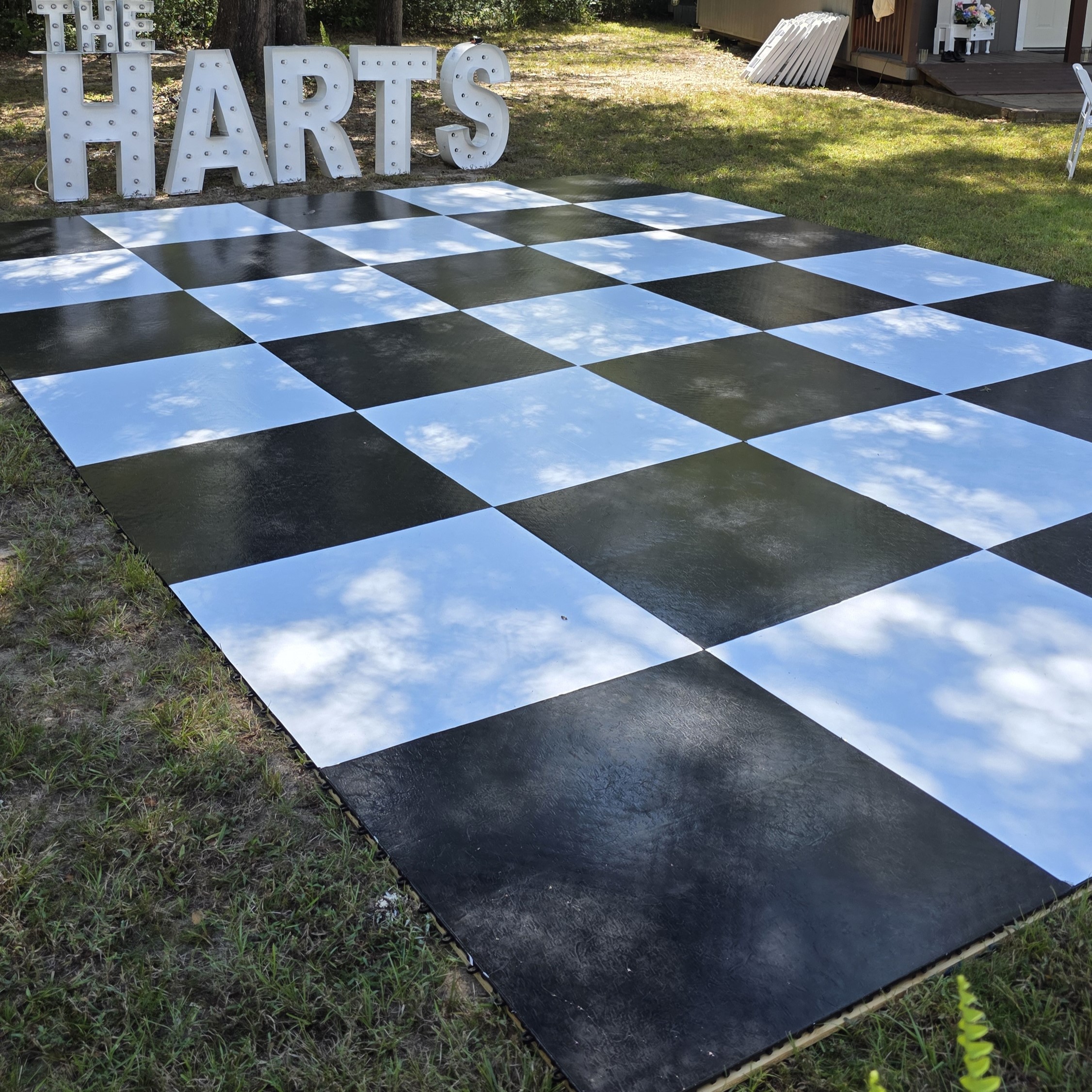 Outdoor Checkerboard Black and White Dancefloor on Grass